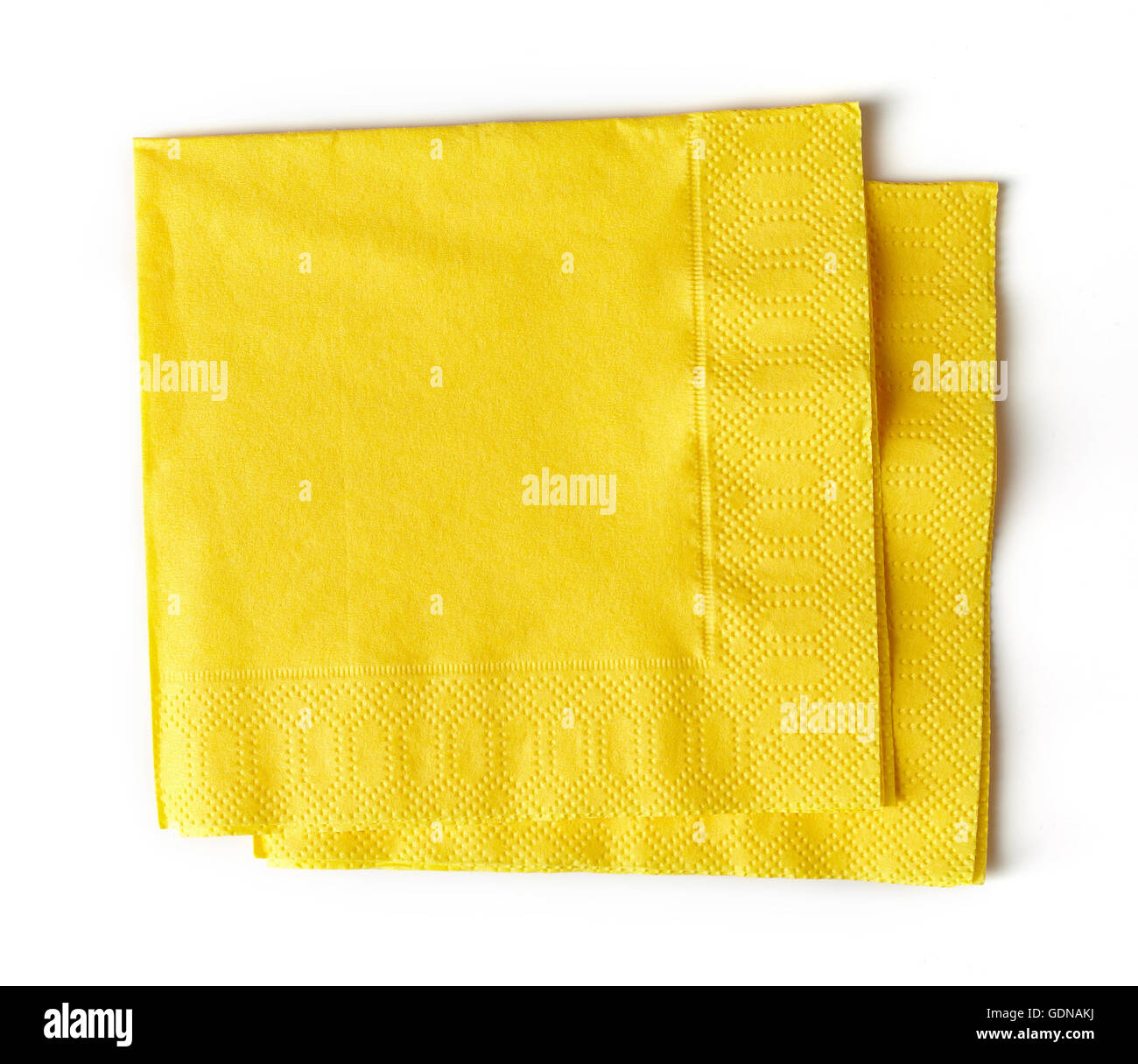 Il giallo di tovaglioli di carta isolato su sfondo bianco Foto Stock