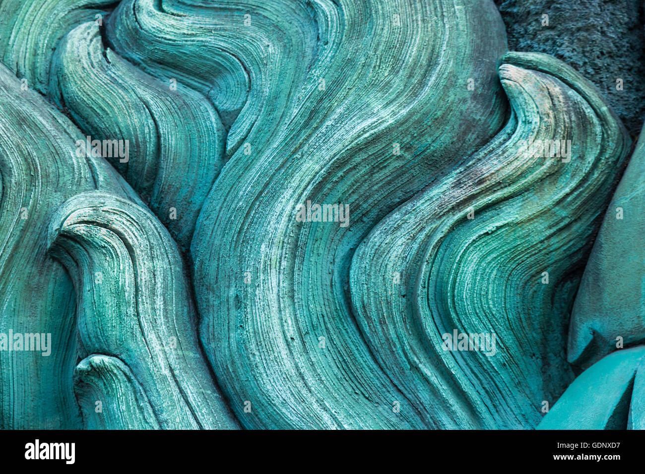 Un color turchese, a forma di onda di decorazione su una parete Foto Stock