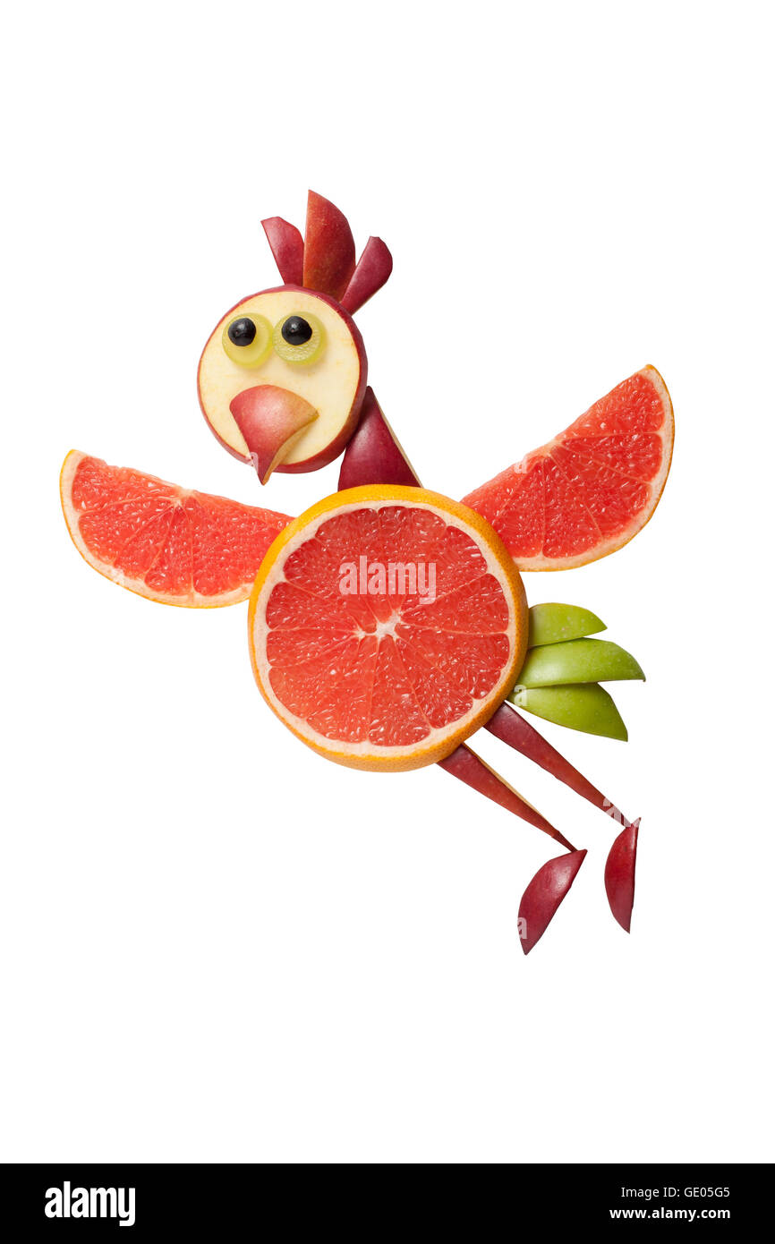 Pollo volanti realizzati di pompelmo su sfondo bianco Foto Stock