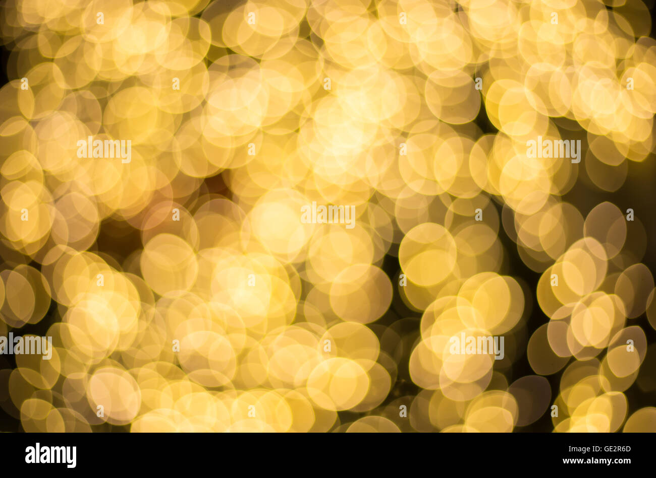 Golden le luci di Natale di notte, Golden sfondo bokeh di fondo Foto Stock