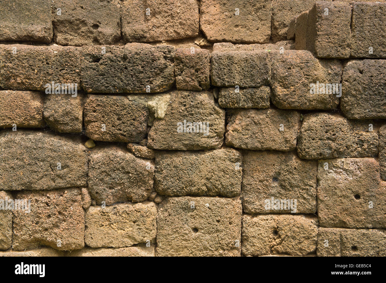 Muro di pietra antica vecchio pavimento Sfondo mattone Foto Stock