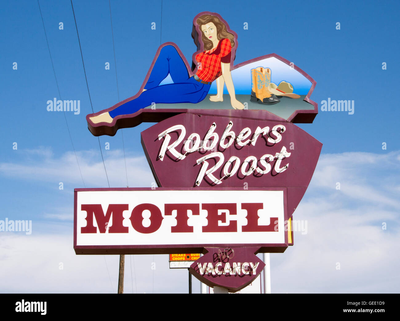 Il cartello del Robbers Roost Motel a Green River, Utah, è un monumento retrò che ricorda la storia del fuorilegge del selvaggio West. Foto Stock