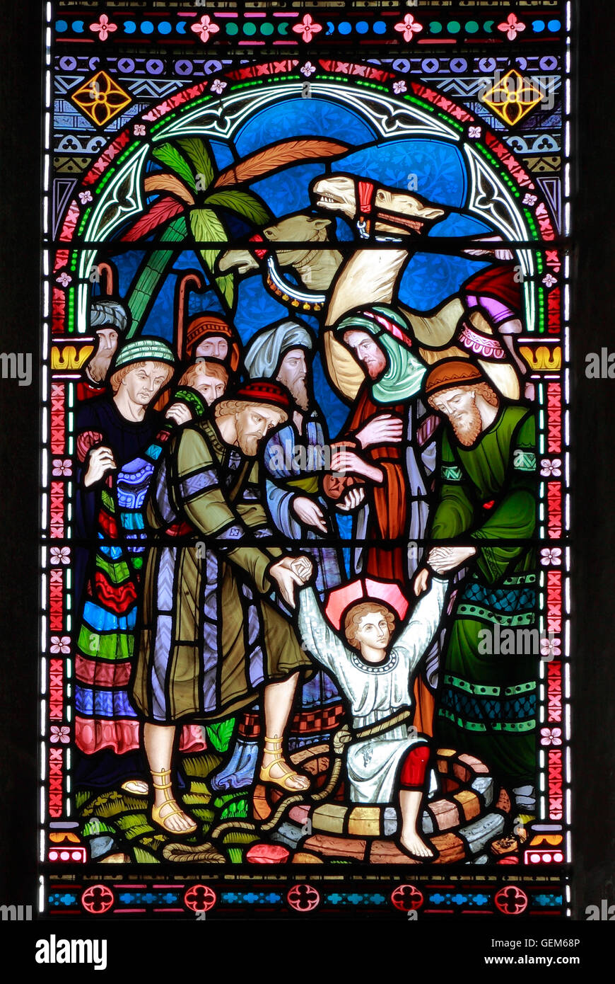 Giuseppe preso dal pozzetto, per essere venduti agli Ismaeliti, Old Hunstanton, dettaglio della finestra di vetro colorato da Federico Preedy Foto Stock