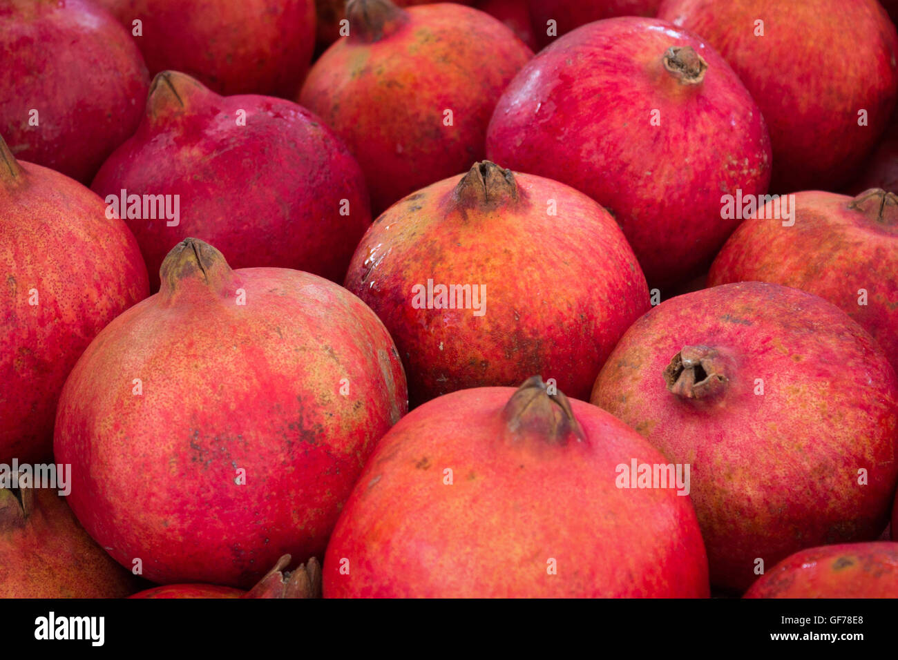 Melograno, grenadine frutta - pila di melograni Foto Stock