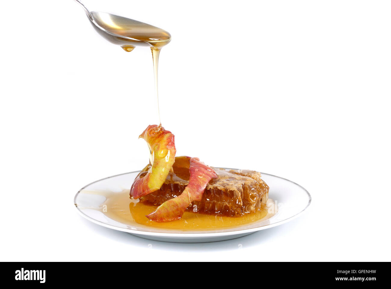 Mele e miele di favo di miele, simboli di Roah Hashanah'anno ebraico su sfondo bianco Foto Stock