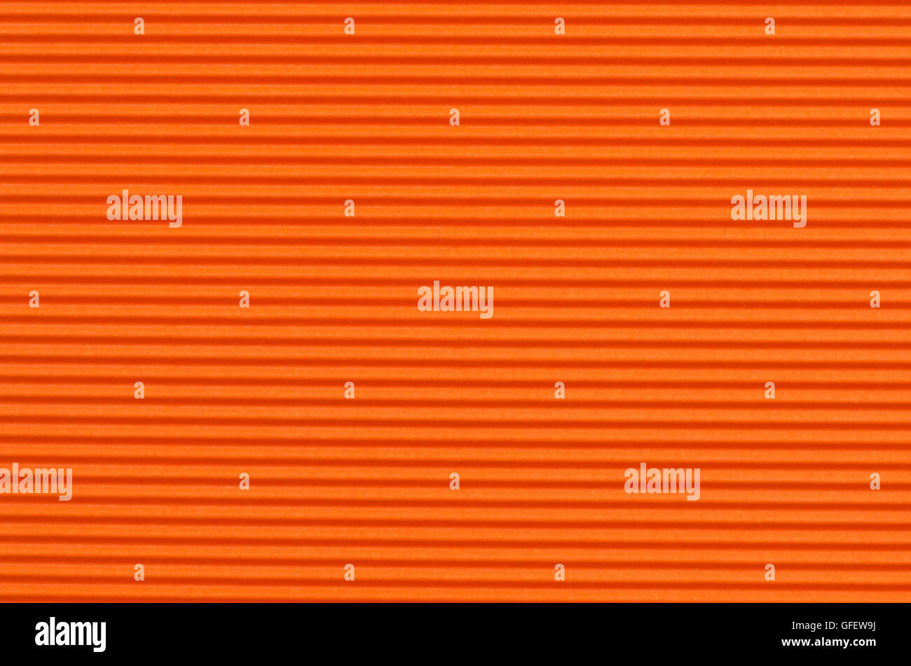 Ondulato di colore arancione carta texture di sfondo Foto Stock