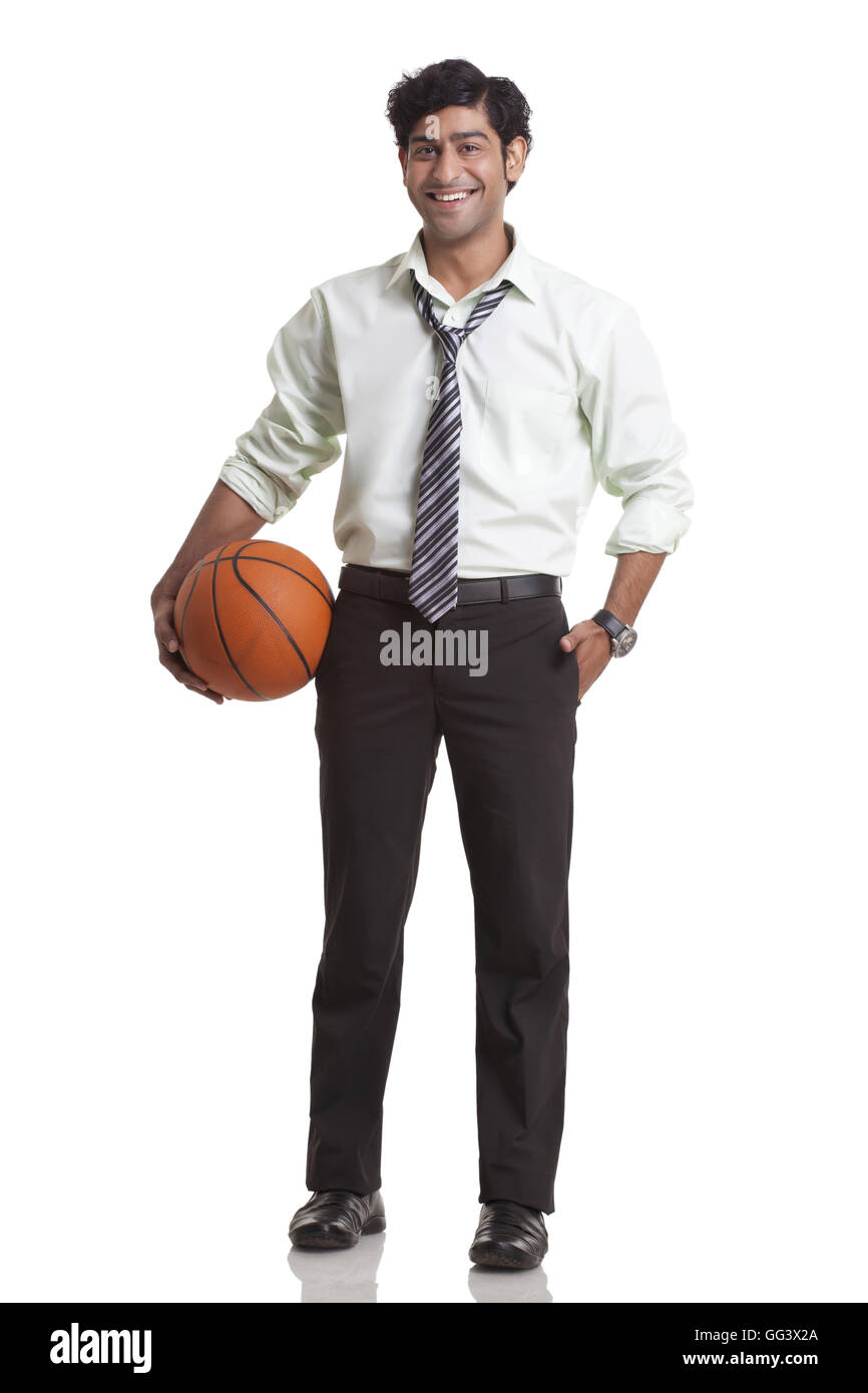 Imprenditore tenendo un basket Foto Stock