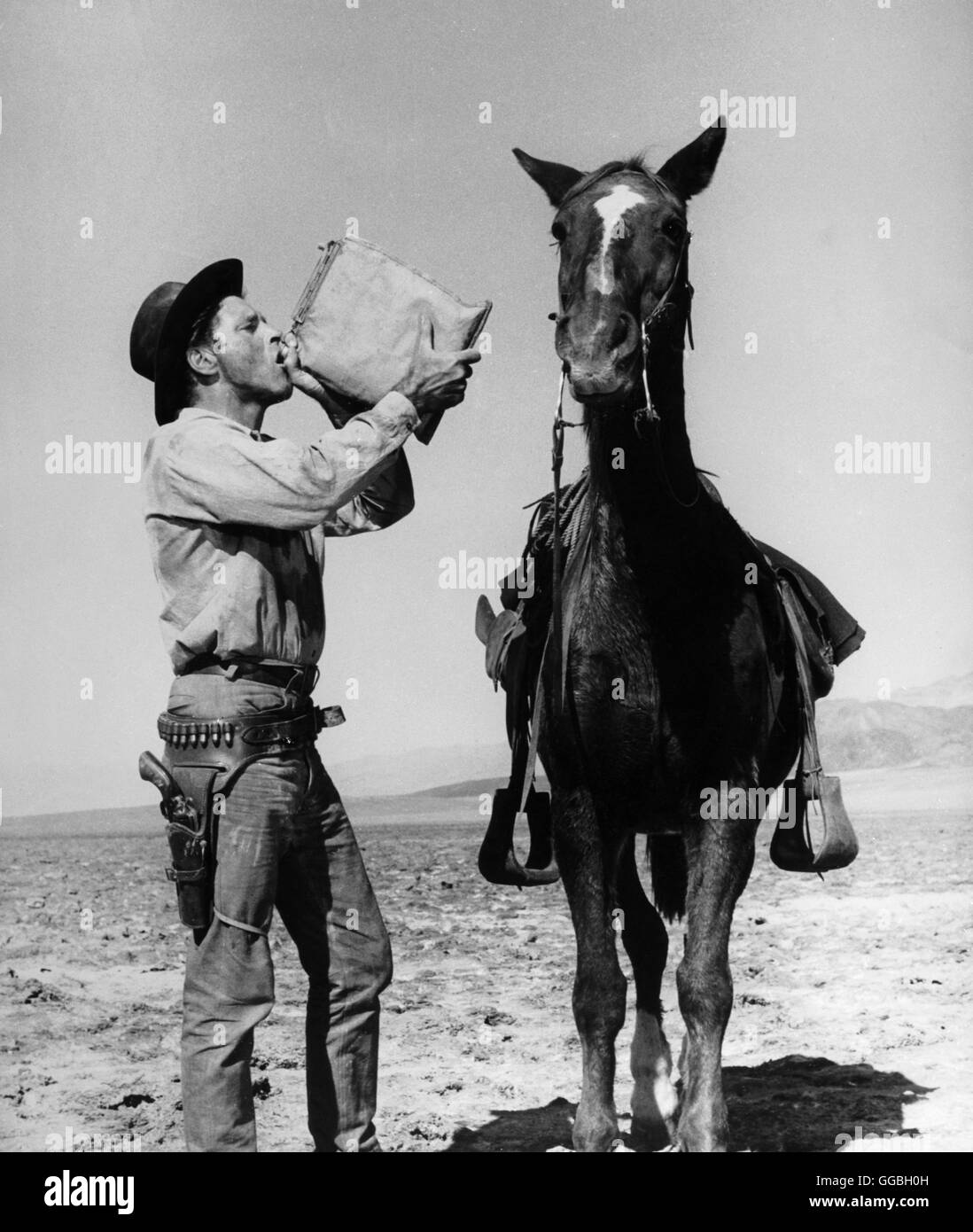 BURT LANCASTER / BURT LANCASTER con cavallo in un film western (ca. 1954) Foto Stock