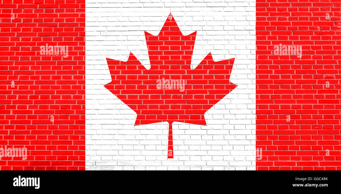 Bandiera del Canada su un muro di mattoni texture dello sfondo. Canadian bandiera nazionale. Foto Stock