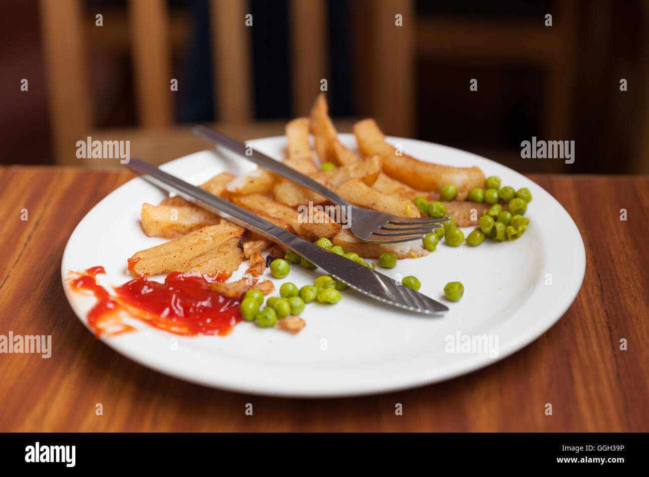 Pesce e patatine finito di oltre Foto Stock