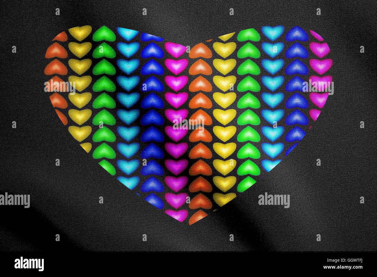 Grande cuore multicolore realizzato da cuori su nero dettaglio texture di tessuto Foto Stock