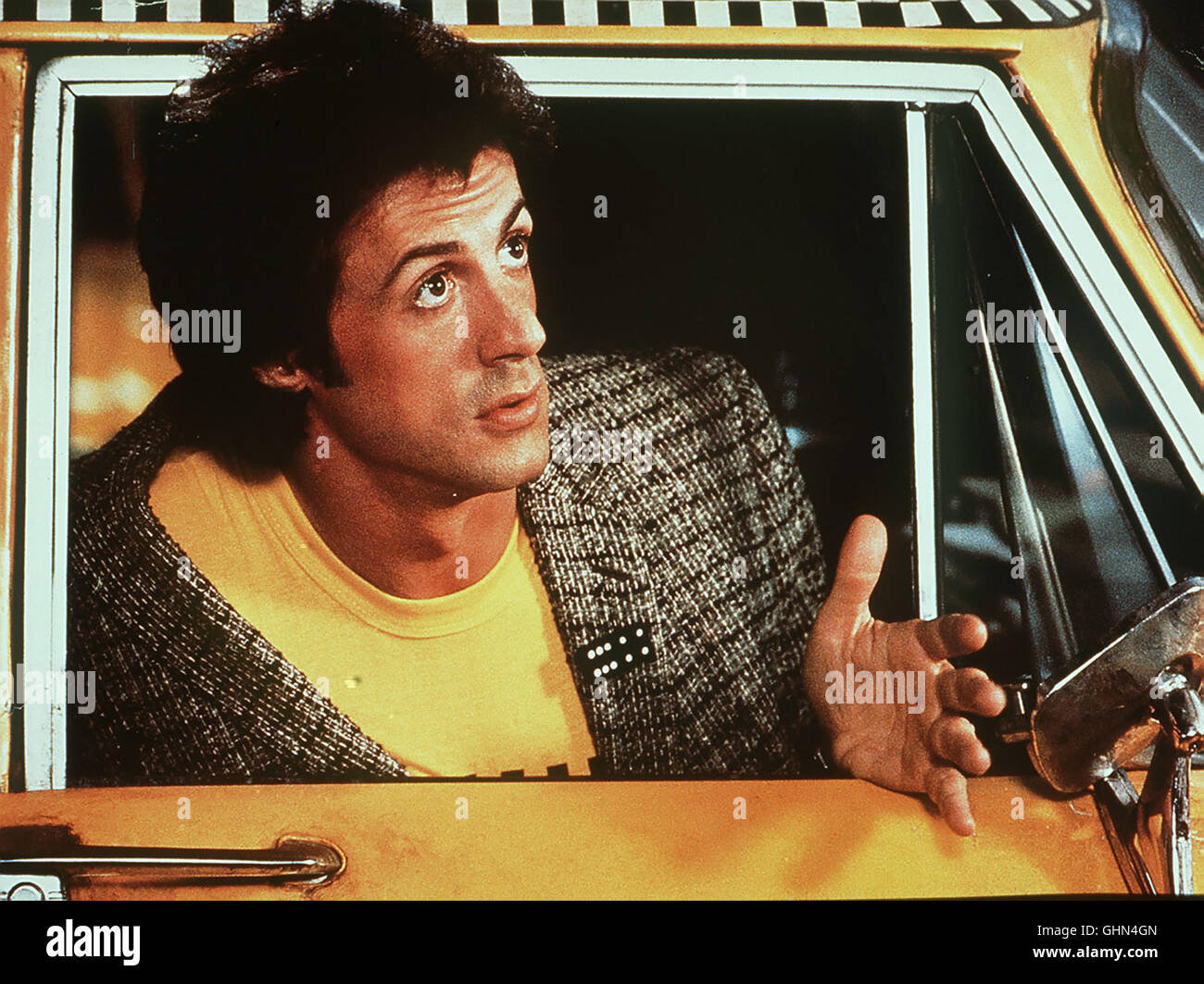 Der senkrechtstarter Auf Grund einer Wette soll die Country-Sängerin aus dem Taxifahrer Nick (Sylvester Stallone) einen Country-Sänger machen... Regie: Bob Clark aka. Strass Foto Stock