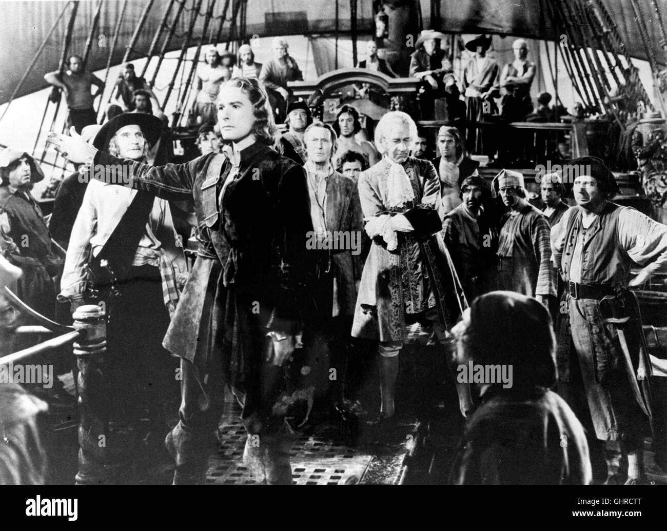 UNTER PIRATENFLAGGE capitano sangue USA 1935 - Michael Curtiz Der junge englische Arzt Pietro sangue wird im Jahre 1685 nach Westindien deportiert. Dort wird er als Sklave verkauft, weil er einem verletzten gegen Rebellen König Jakob II. geholfen hat. Es gelingt ihm, mit einer Handvoll entschlossener Gefährten zu entfliehen und ein spanisches Kriegsschiff zu kapern. Il sangue und seine Männer gelten fortan als gefürchtete Freibeuter Karibischen im Meer, bis sie beweisen können, dass Sie mehr sind als goldgierige Piraten. Foto: Szene mit capitano sangue (Errol Flynn) Regie: Michael Curtiz aka. Il capitano Foto Stock