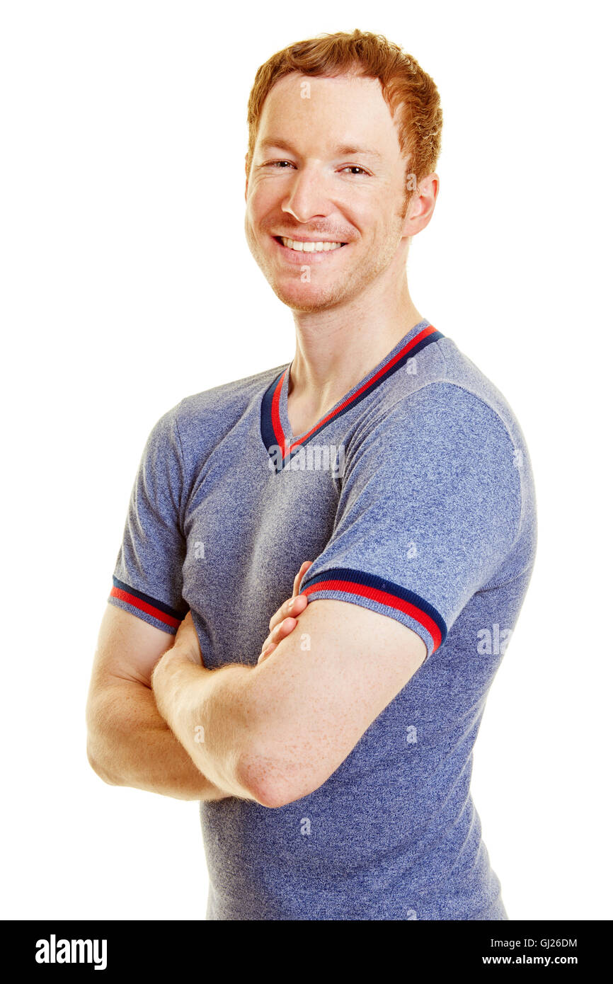 L'uomo come un atleta sorridente con le braccia incrociate Foto Stock