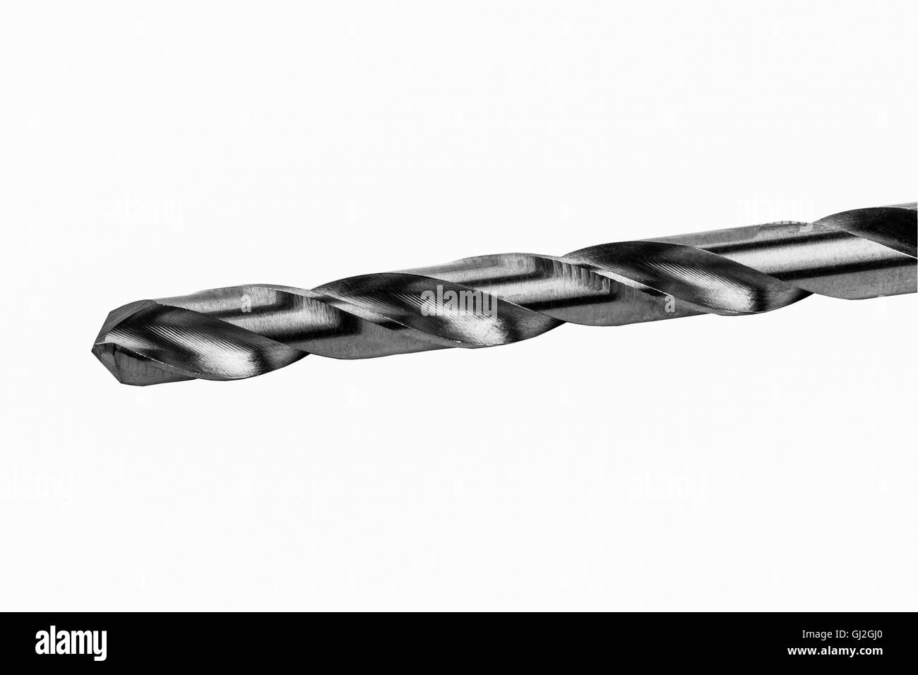 In prossimità di una punta di trapano in bianco e nero isolato su uno sfondo bianco Foto Stock