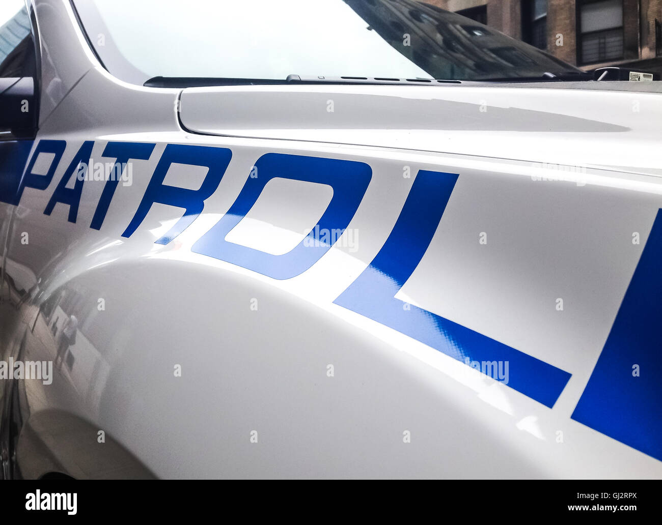 Una vista parziale di una pattuglia di ingrandita su la parola "Patrol'. Foto Stock