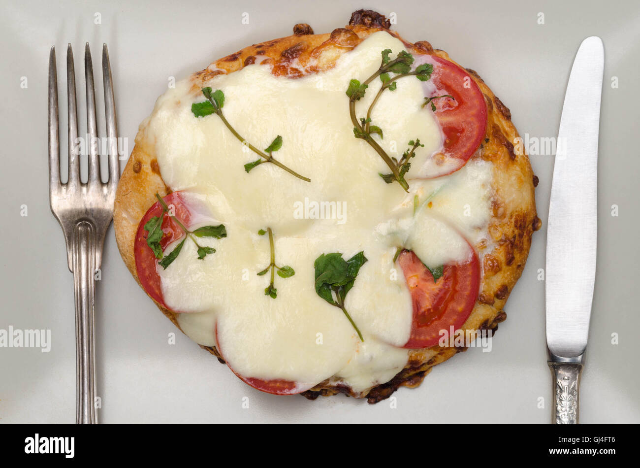 In casa italiana mini pizza sulla piastra Foto Stock