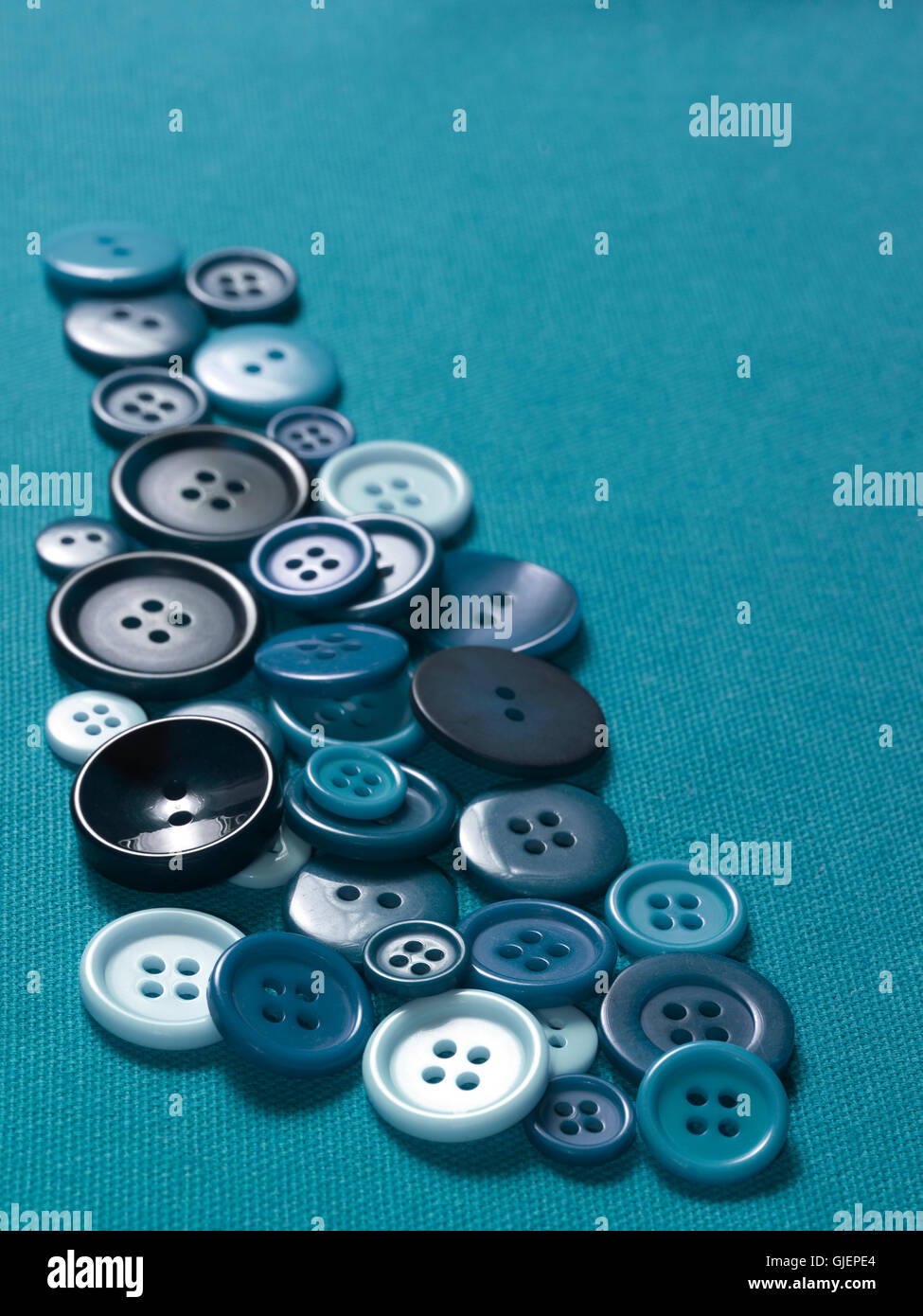 I pulsanti blu su materiale Foto Stock