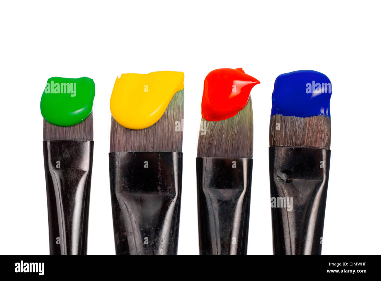 Quattro pennello con colori di base Foto Stock
