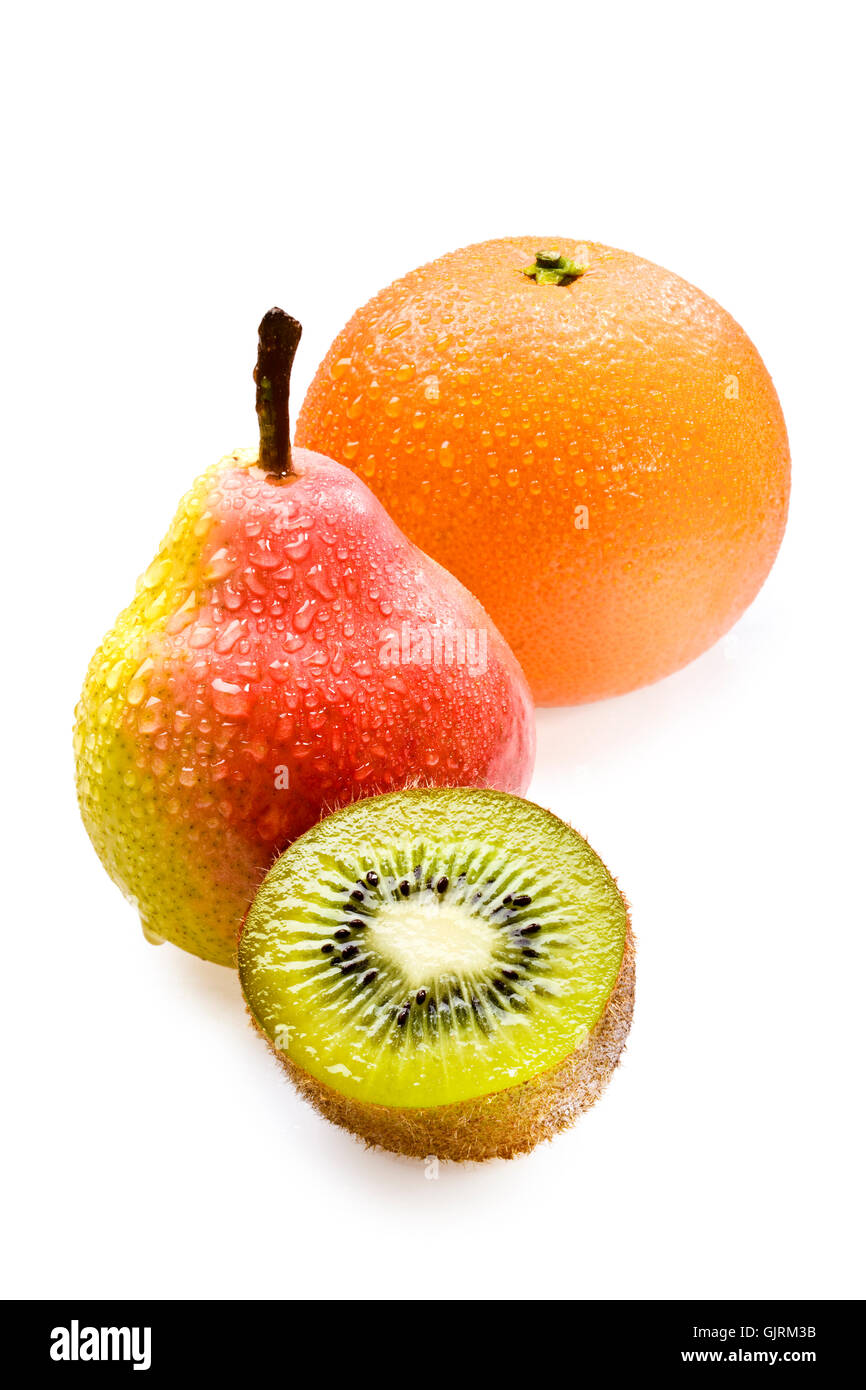 La metà di un kiwi, pera e arancia Foto Stock