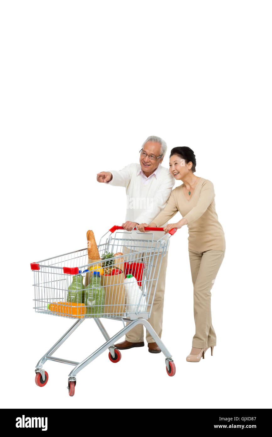 Studio shot vecchia coppia shopping Foto Stock