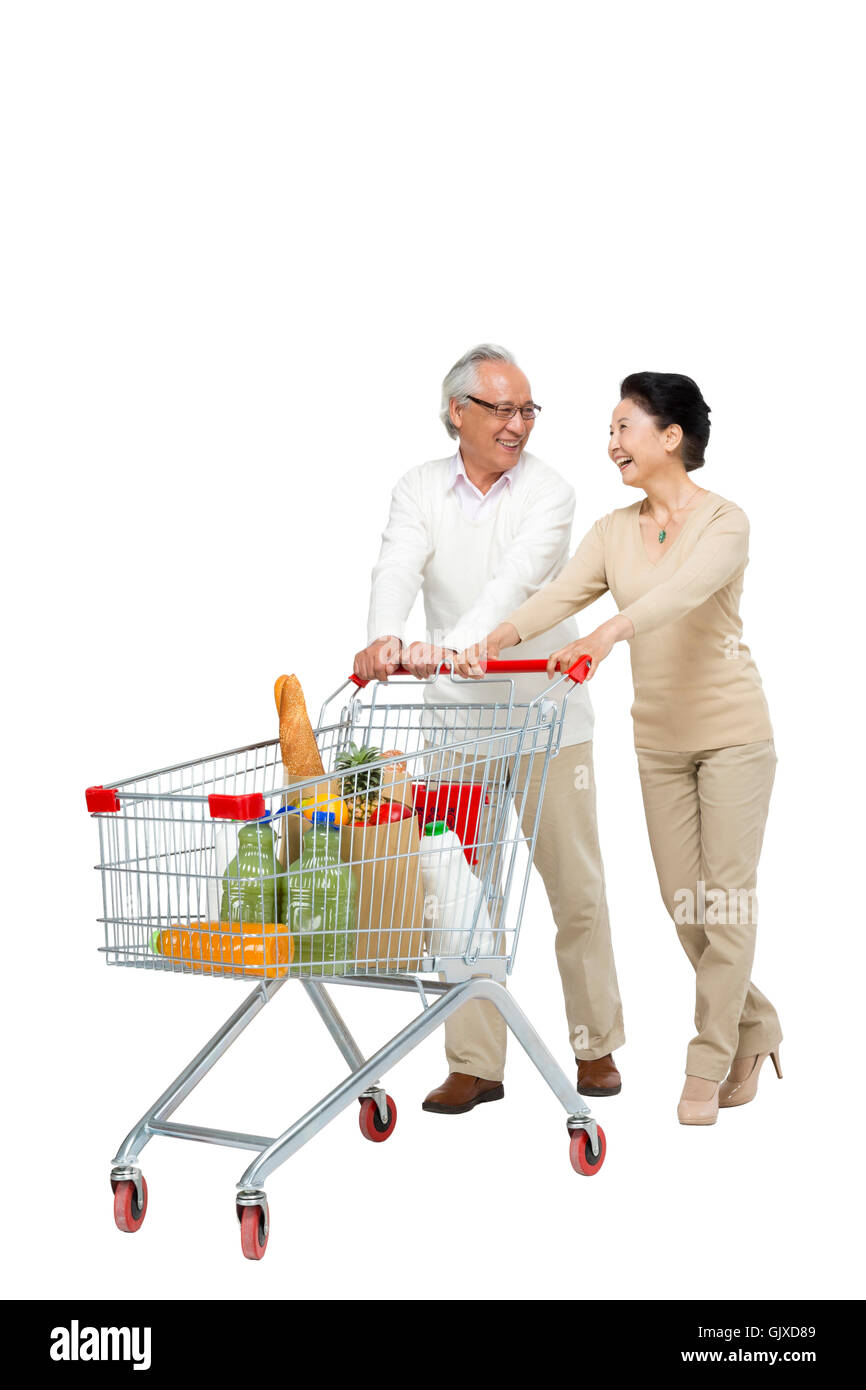 Studio shot vecchia coppia shopping Foto Stock