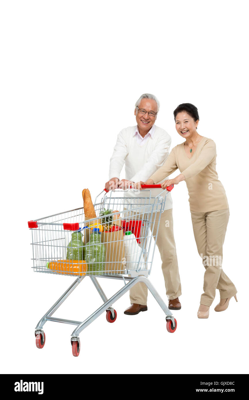 Studio shot vecchia coppia shopping Foto Stock