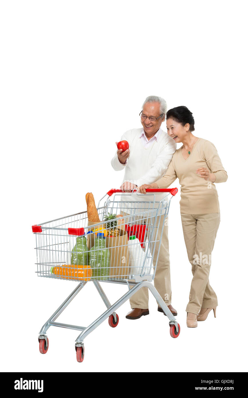 Studio shot vecchia coppia shopping Foto Stock