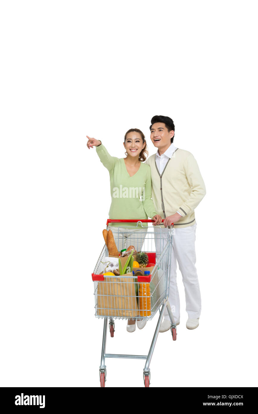 Studio shot coppia giovane shopping Foto Stock