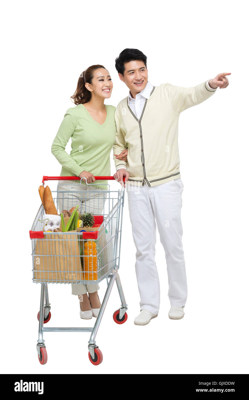 Studio shot coppia giovane shopping Foto Stock