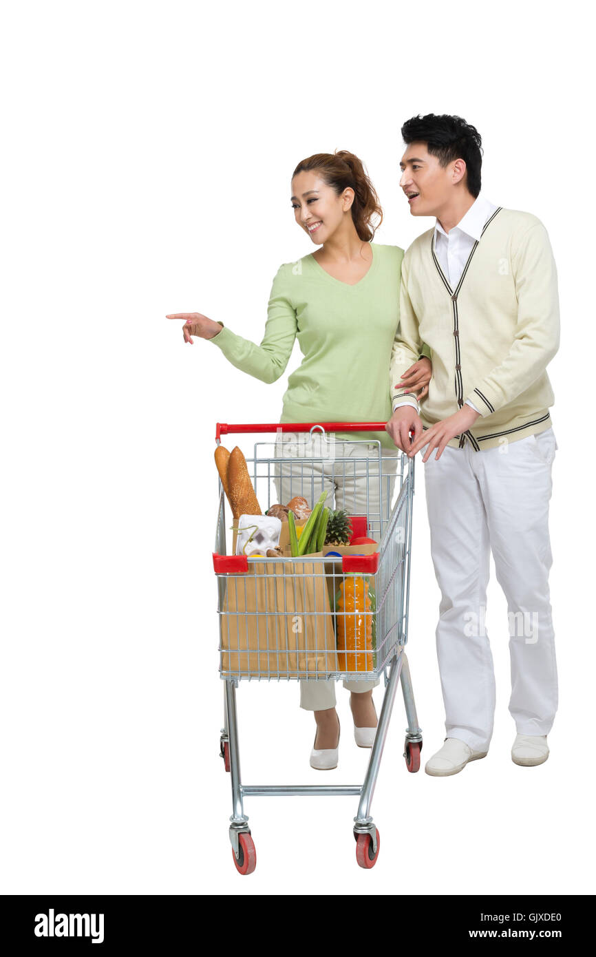 Studio shot coppia giovane shopping Foto Stock