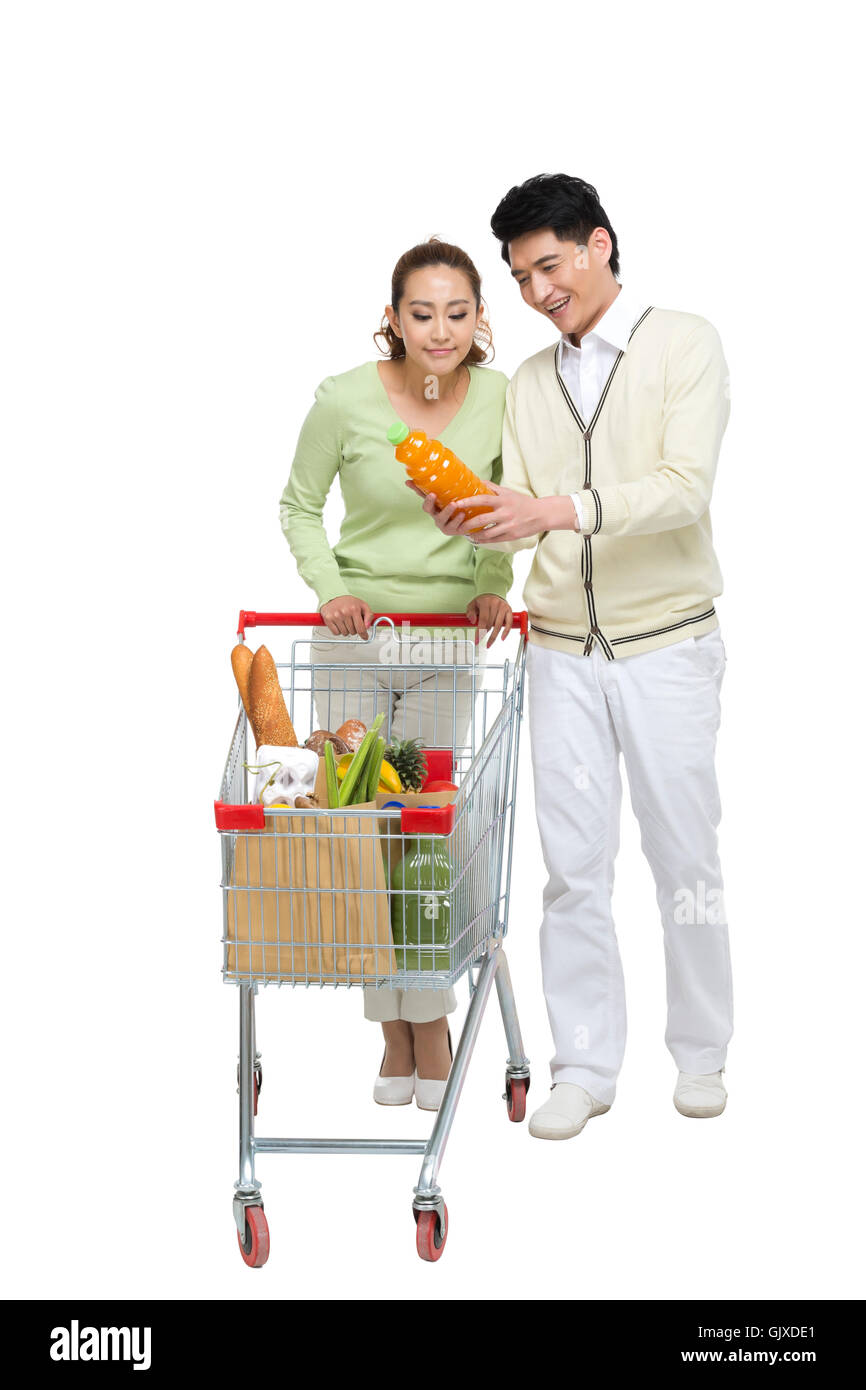 Studio shot coppia giovane shopping Foto Stock