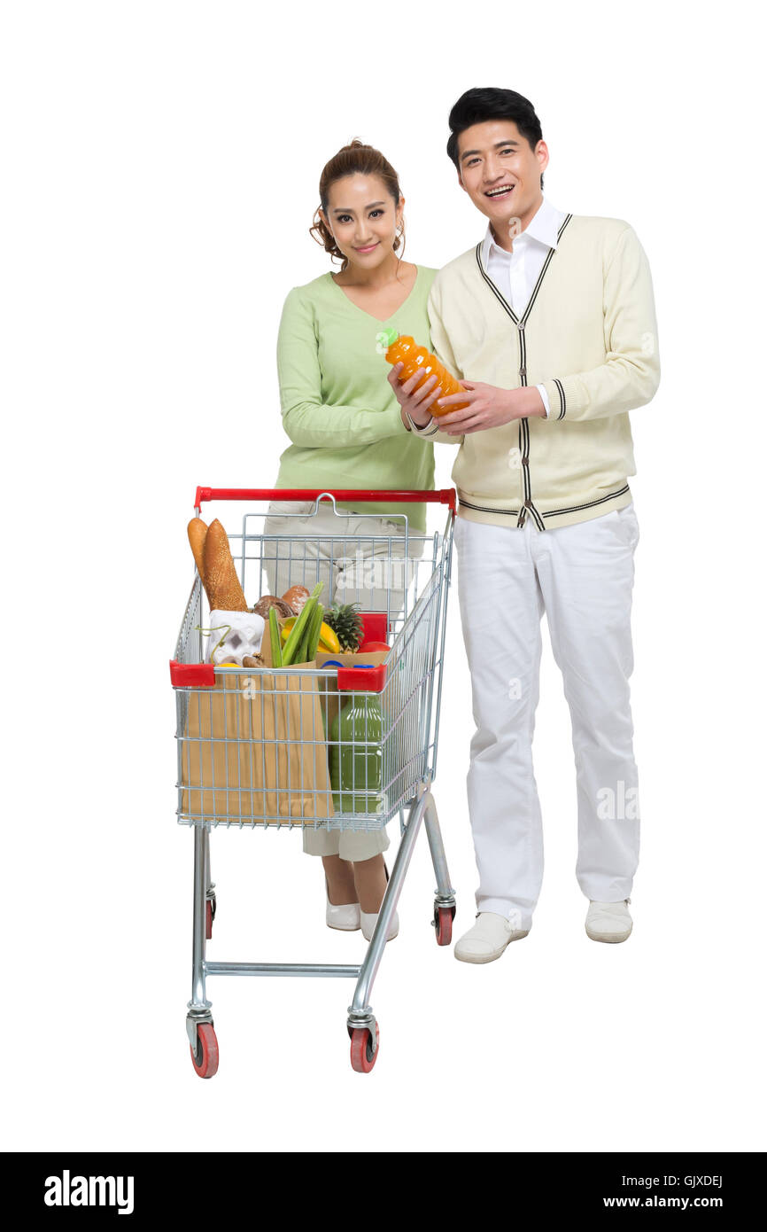 Studio shot coppia giovane shopping Foto Stock