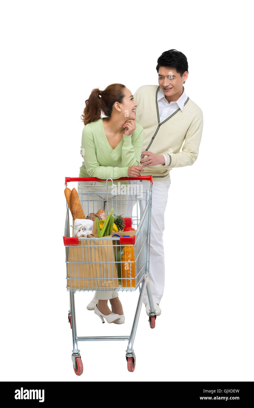 Studio shot coppia giovane shopping Foto Stock