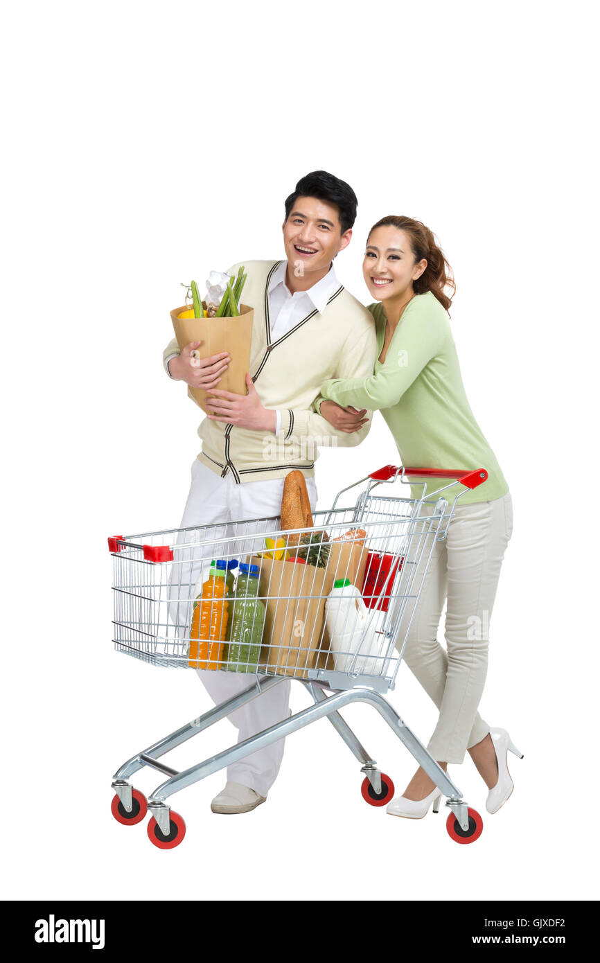 Studio shot coppia giovane shopping Foto Stock