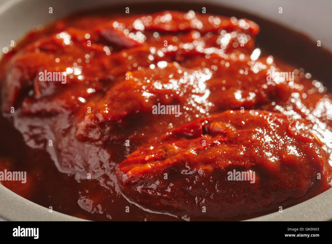 Chipotle peperoni in salsa Adobo Foto Stock