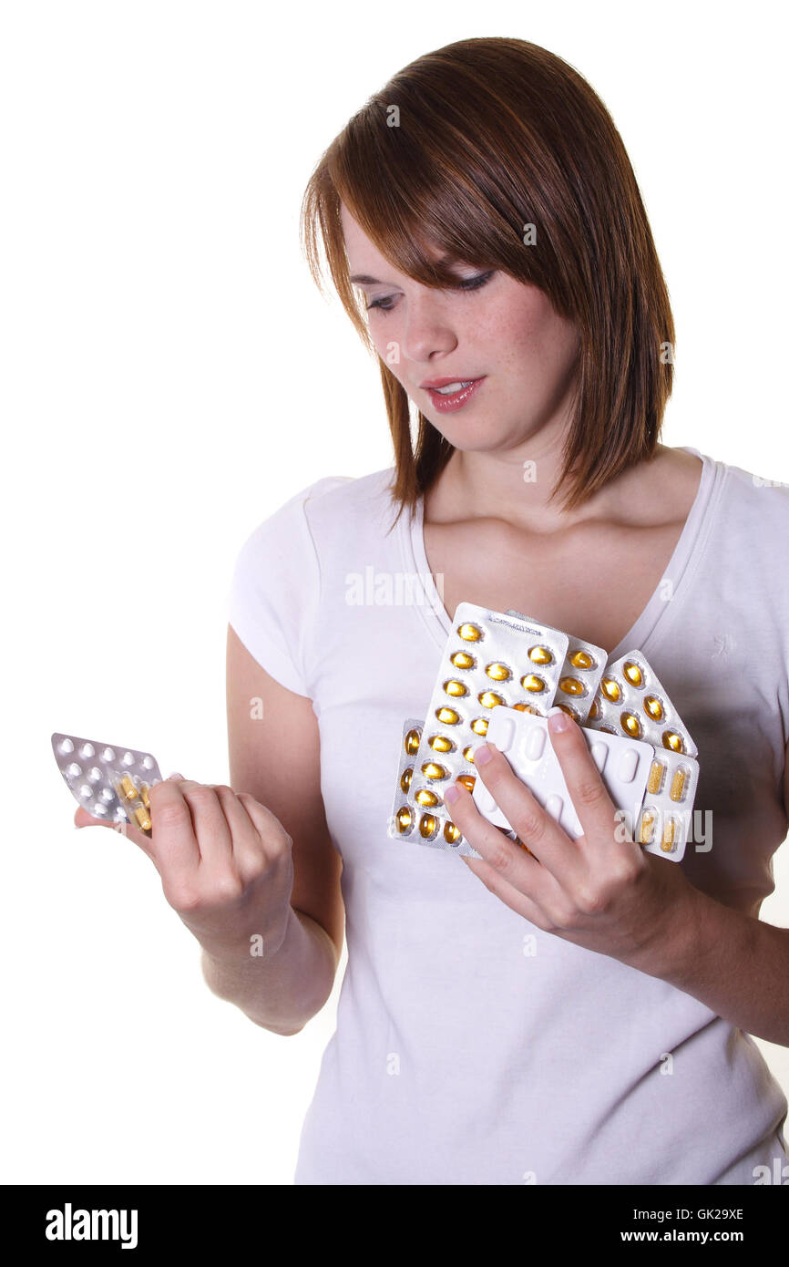 Donna pillole compresse Foto Stock