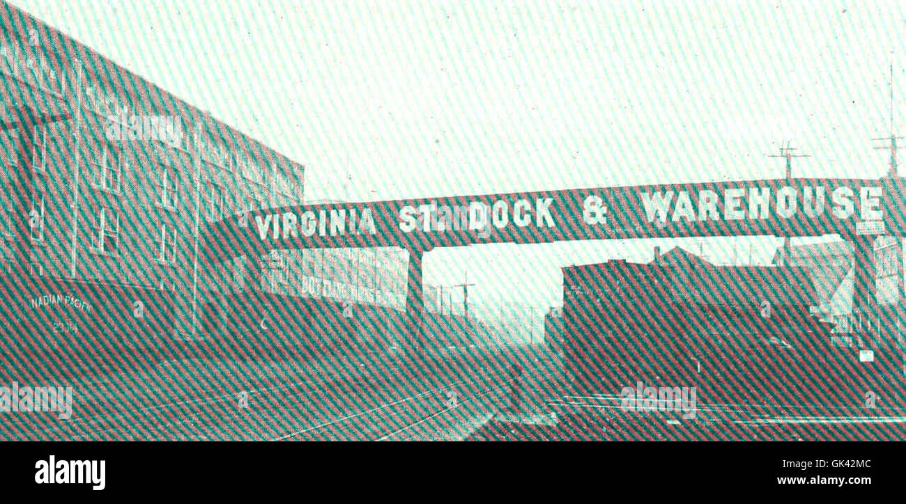 Virginia Street Dock and Warehouse Co., Inc. A Seattle, Stati Uniti, mette in mostra magazzini legati e un sistema di trasporto coperto utilizzato per la spedizione e la movimentazione delle merci. Questa infrastruttura sostiene le attività industriali e commerciali della regione. Foto Stock