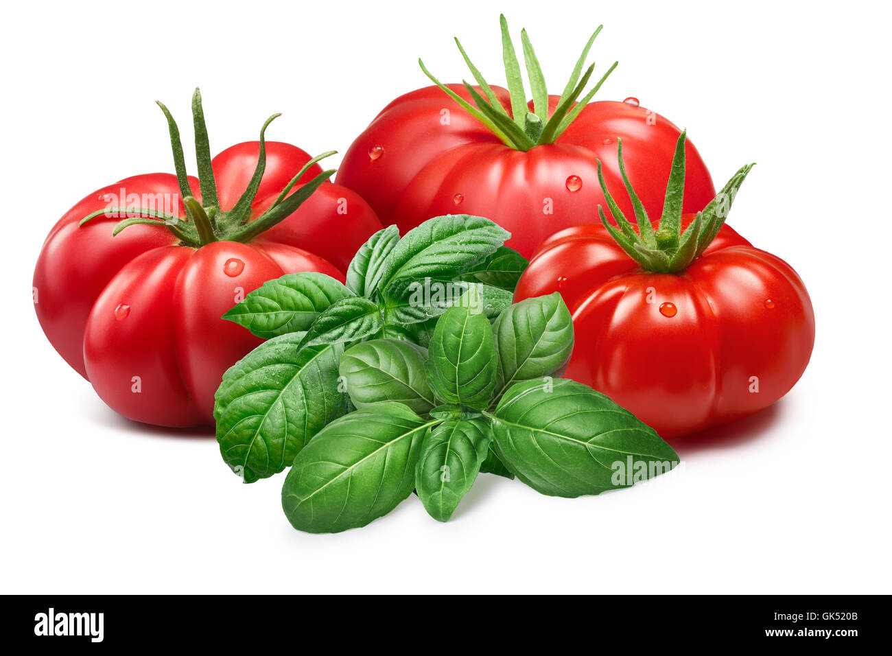 Freschi i pomodori costoluti con basilico genovese.tracciati di ritaglio, ombre separate, infinita profondità di campo. Gli elementi di design Foto Stock