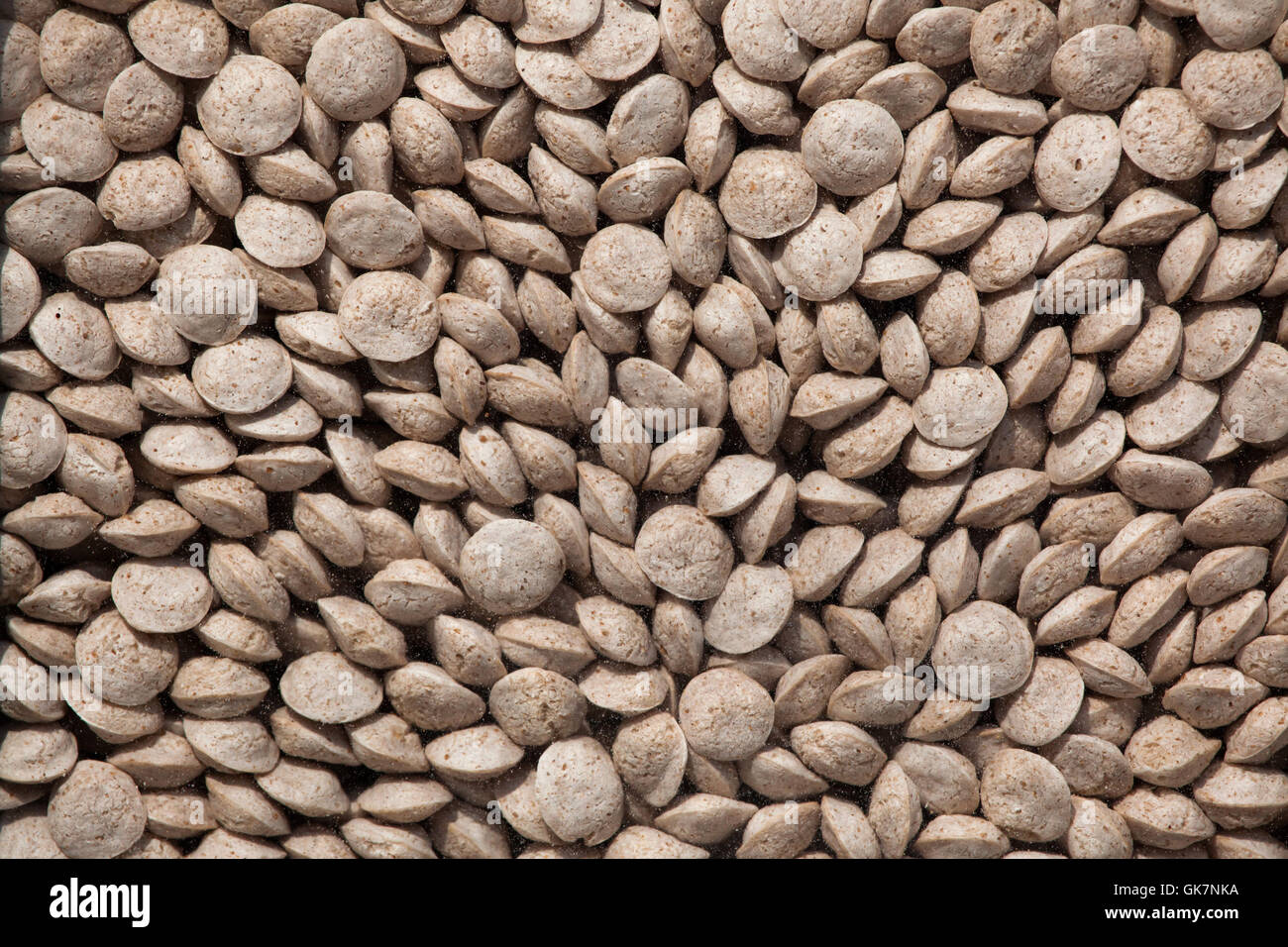 Alimenti per animali pellet. Texture di sfondo. Foto Stock