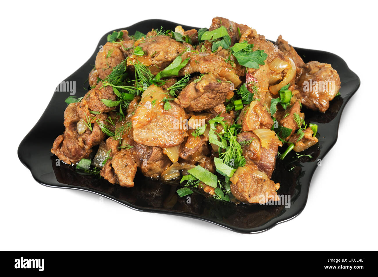 Stufato con cipolle su una piastra. Foto Stock