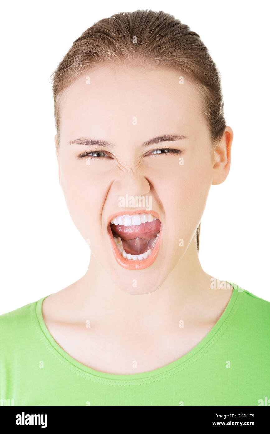 Giovane donna informale urlando con rabbia Foto Stock