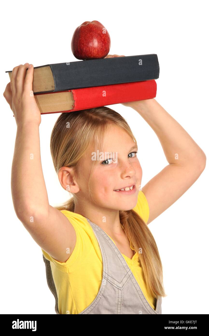 Giovane studente Ragazza con libri e Apple Foto Stock