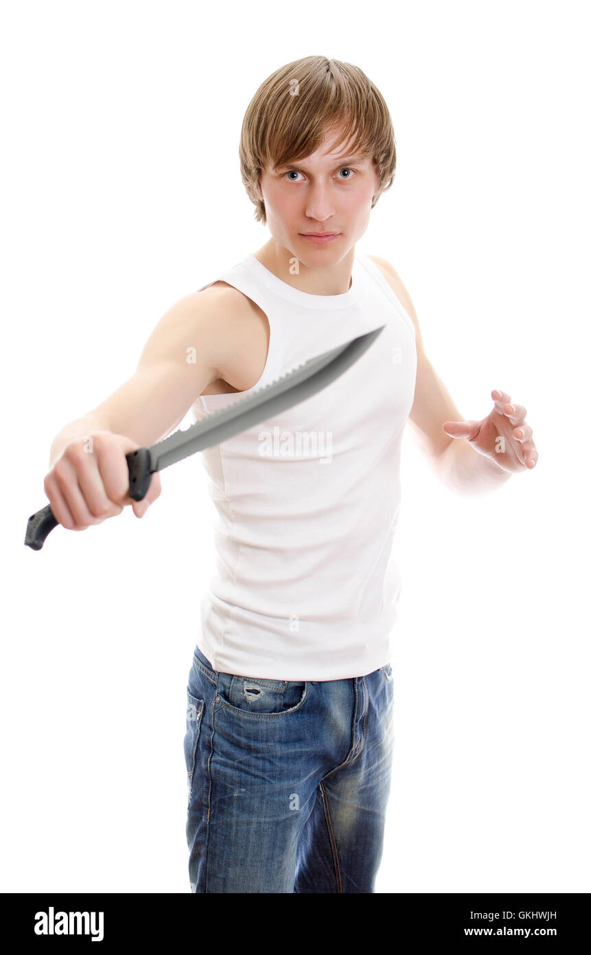 Il machete coltello in mano. L'uomo è in possesso di un coltello. Albero e  fogliame Foto stock - Alamy