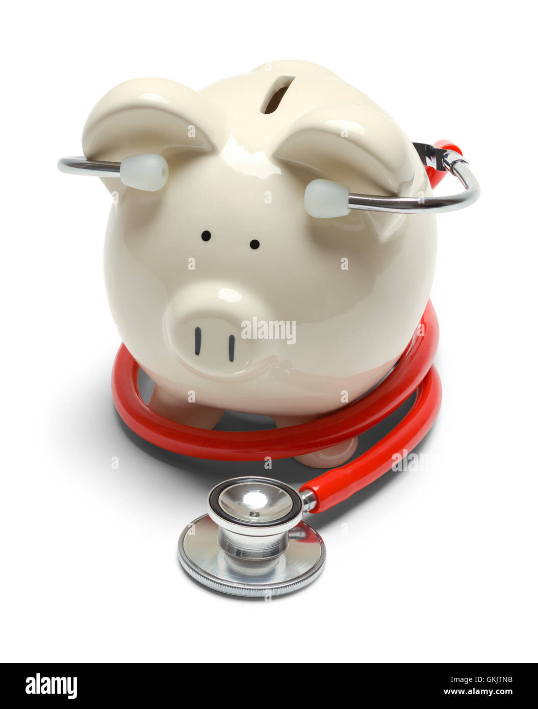 Salvadanaio con stetoscopio rosso isolato su sfondo bianco. Foto Stock