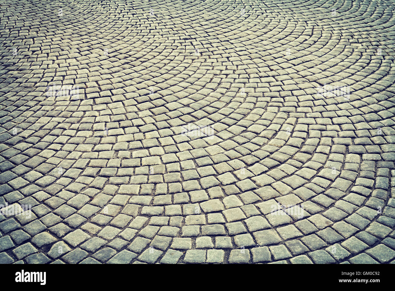 Vintage tonica cobblestone pavement sfondo, strada di Vienna, Austria Foto Stock