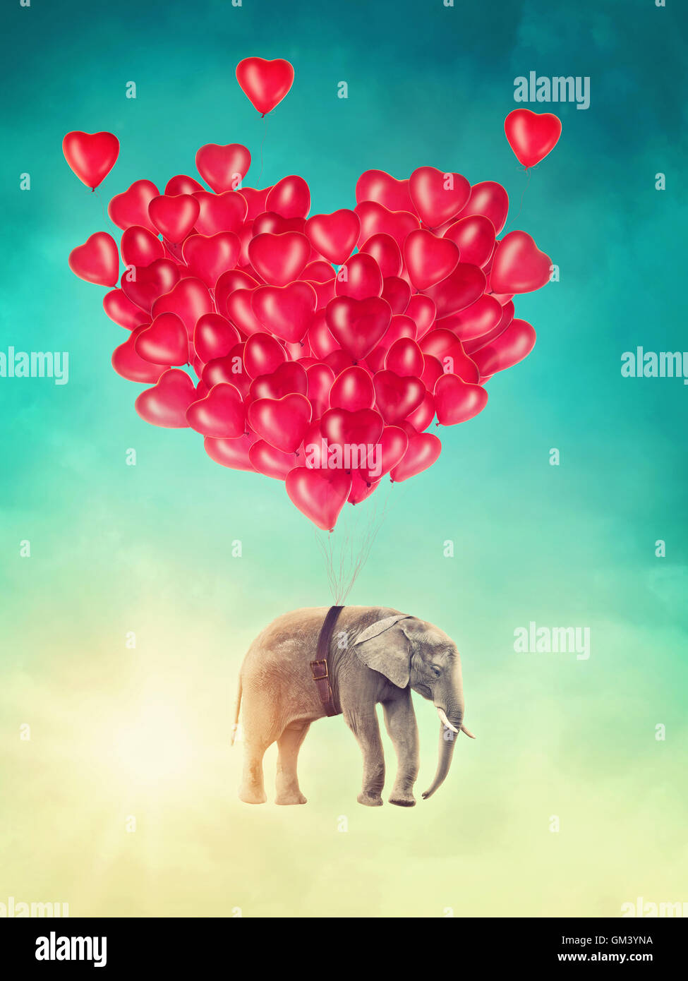 Elephant battenti con palloncini nel cielo Foto Stock