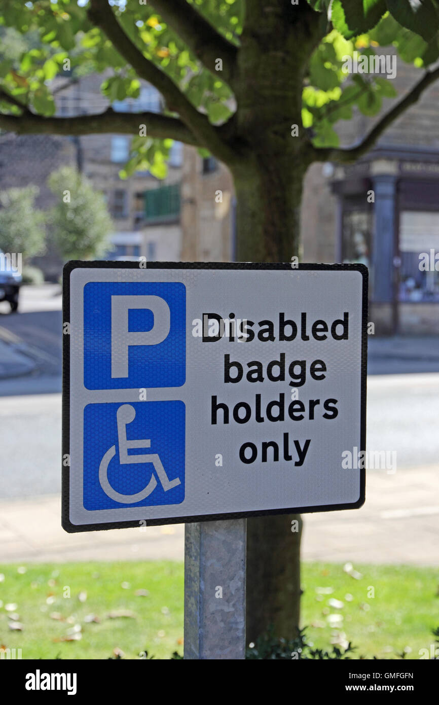 Badge disabili titolari simbolo di parcheggio Foto Stock