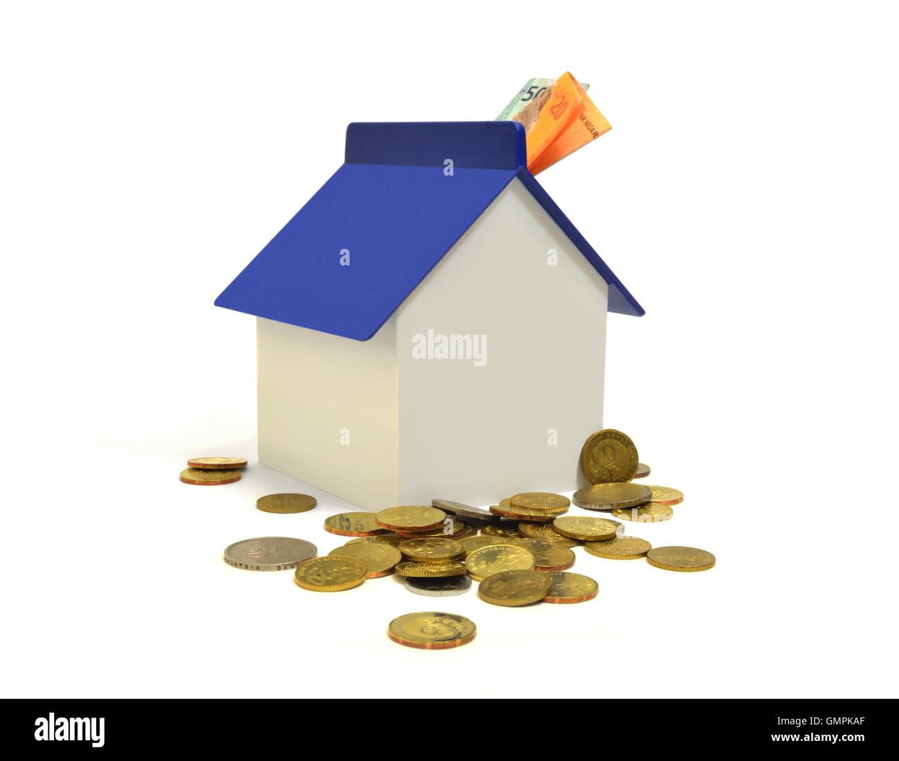 Casa e monete, proprietà Concetto di investimento Foto Stock