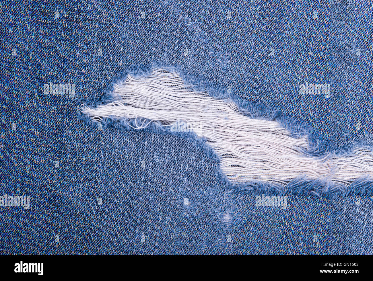 Jeans strappati texture denim Foto Stock
